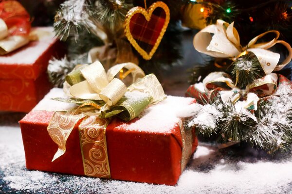 New Year s gifts under the snow tree