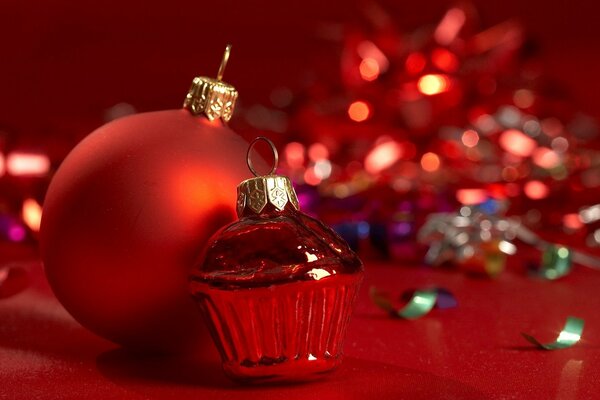 A fiery red ball on a background of sparkling tinsel