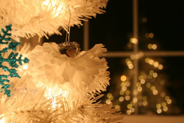 Christmas wallpaper with a silver Christmas tree, backlight and a bokeh ball