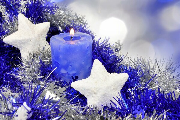 Happy holiday in white stars and a lilac candle