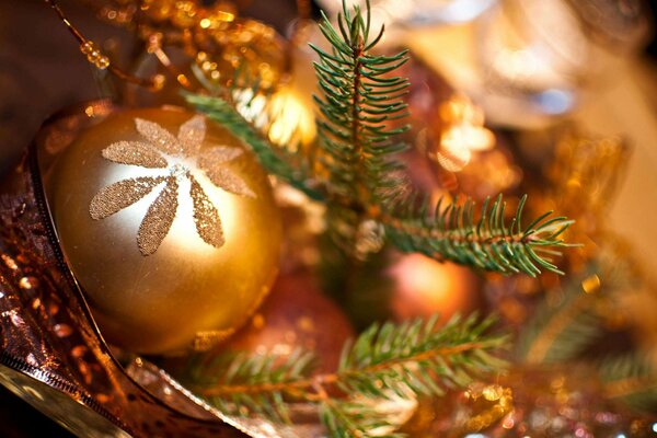 Golden Christmas ball at the Christmas tree