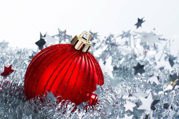 Red Christmas ball on tinsel