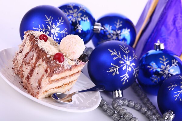 Blue and silver balls near the cake