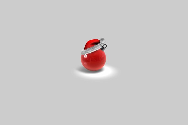 Boule rouge de Noël dans un bonnet