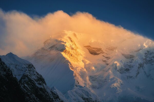 Snowy mountain top in fog