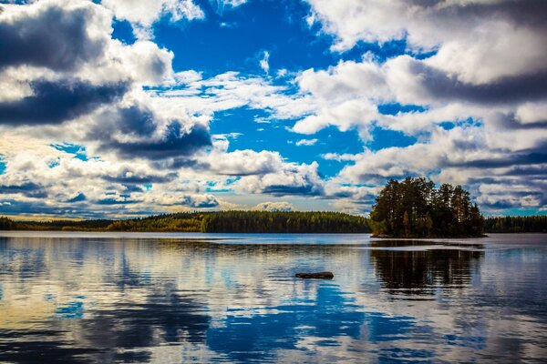 Beautiful landscape of Finland. Trees, water, clouds