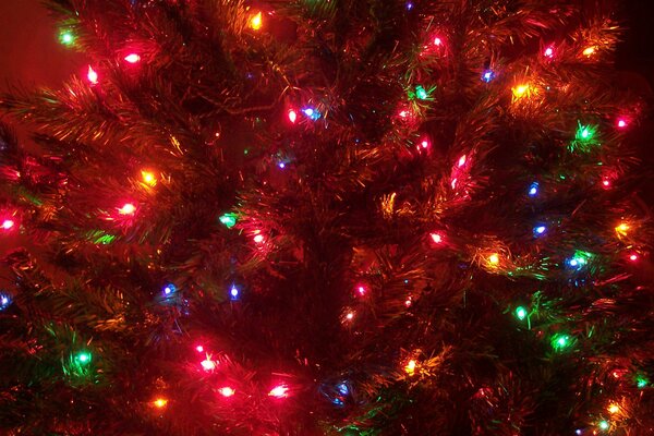 Glowing Christmas garland on the Christmas tree