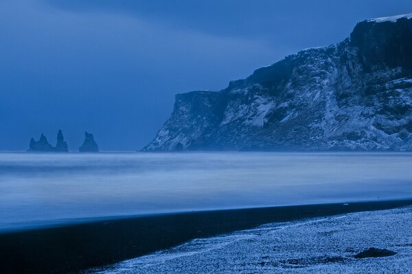 Atlantic ocean and snow-capped mountains