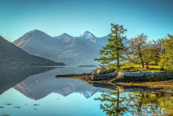 Serene water surface against the background of mountain ranges