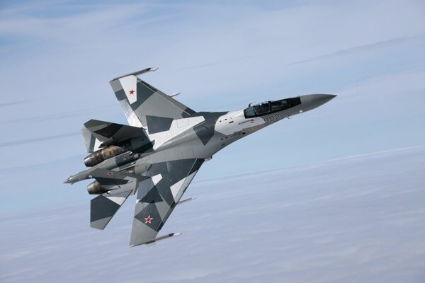 The Su-35 fighter is flying in the sky