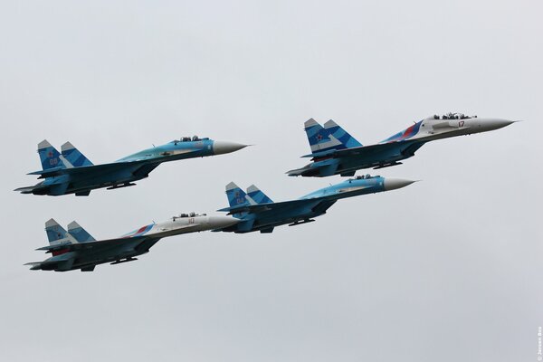 Four Russian SK-27 fighters fly in a wedge