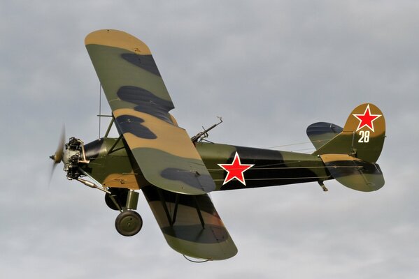 Multi-purpose biplane in the sky at altitude