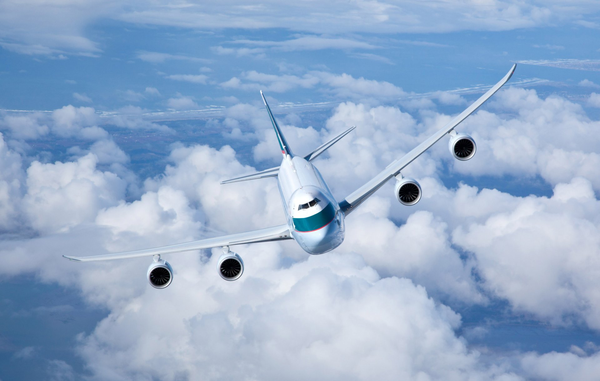 cathay pacific cargo flight flying in the air sky cloud