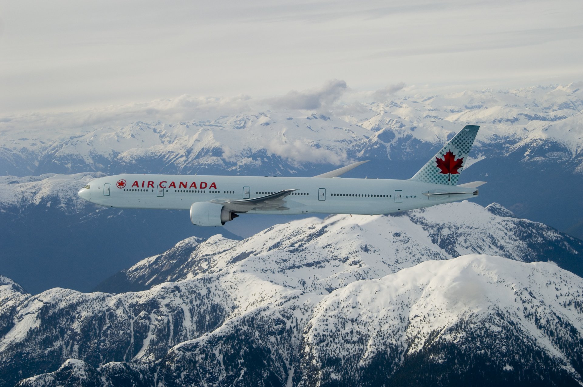 air canada boeing 777-300er flight mountain clouds snow maple leaf