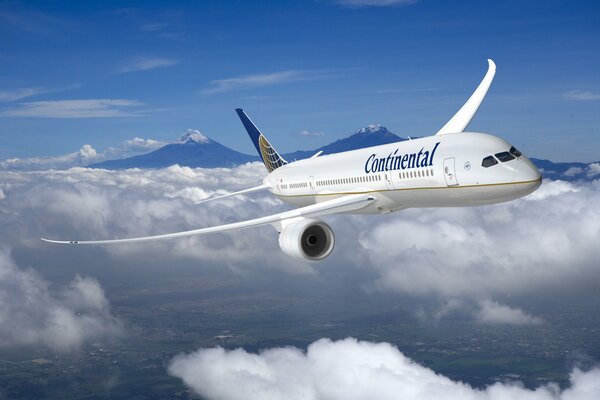 Image of a flying airliner in the clouds