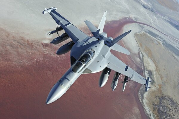 Avión militar estadounidense Boeing en el fondo de la superficie terrestre