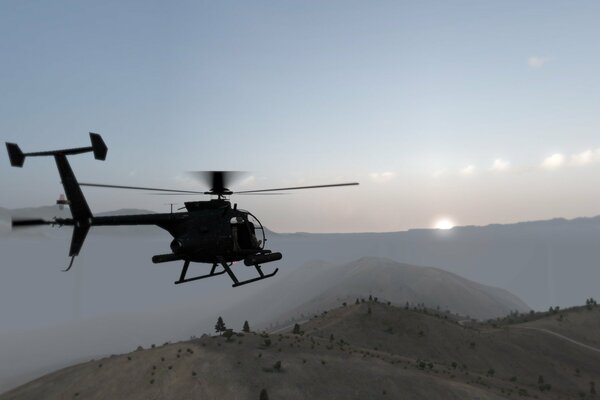 Helicopter flight over the mountains at sunset