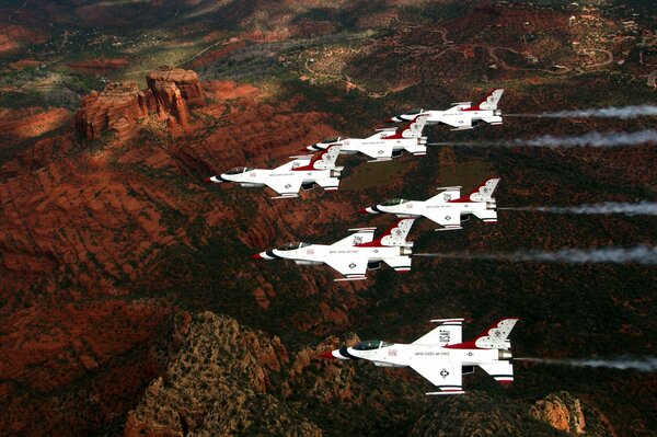 Six fighters are flying in formation