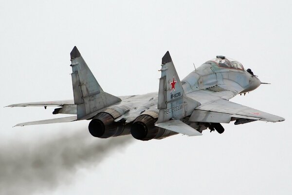 A powerful mig-29ub fighter is flying in the sky