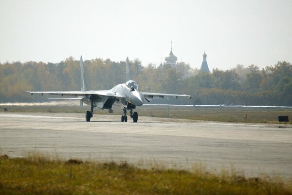 Su-35 fighter jet stands on the runway