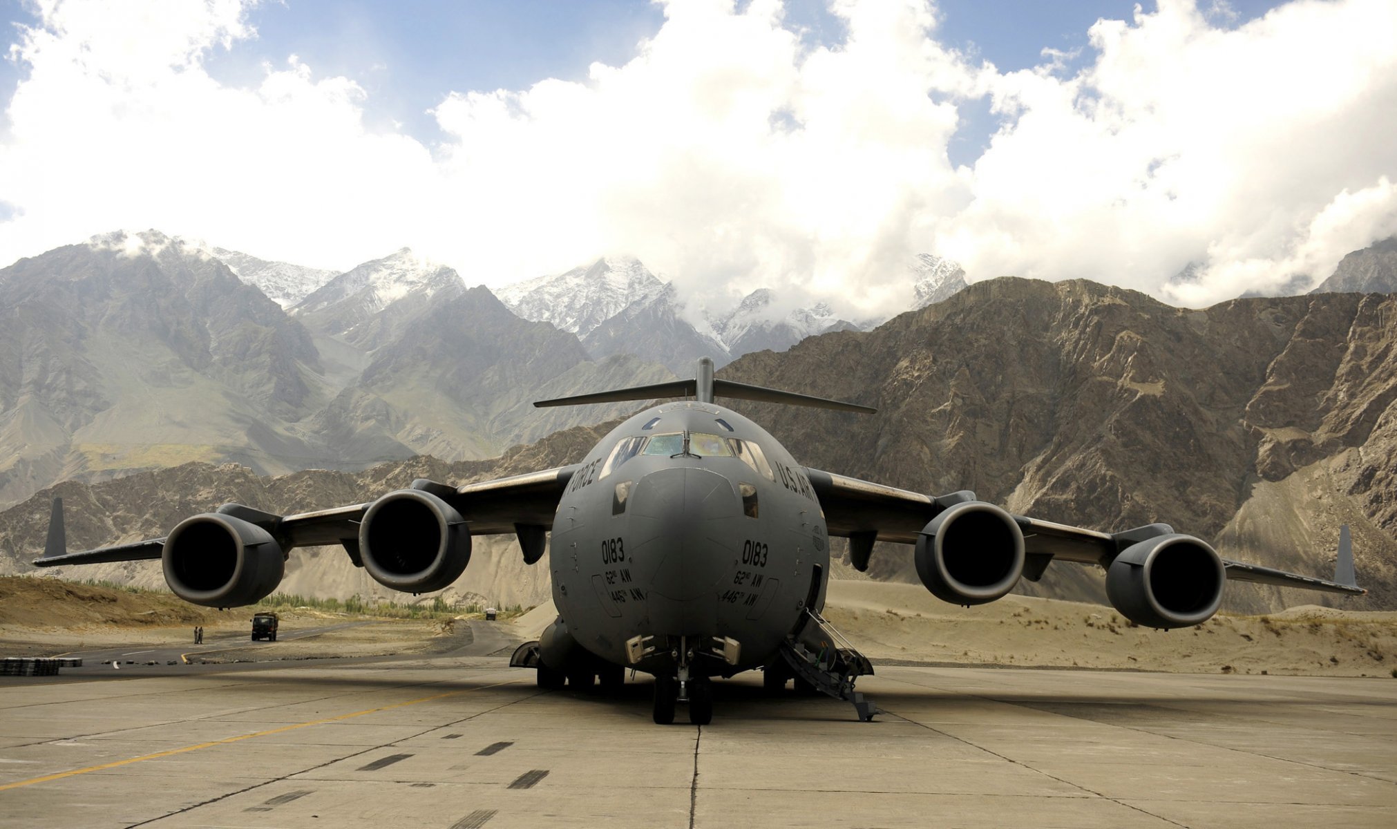 plane photo airport mountain valley clouds sky military aviation