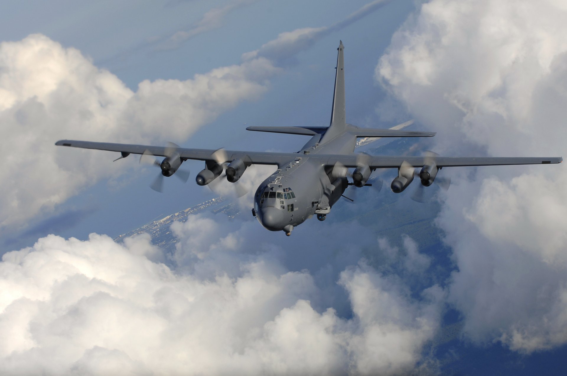 ac-130 plane flight clouds horizon sky