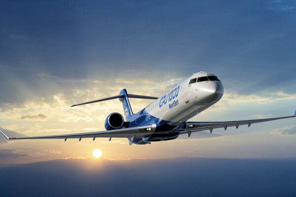 Un nouvel avion bombardier CRJ 1000 Next Gen au lever du soleil