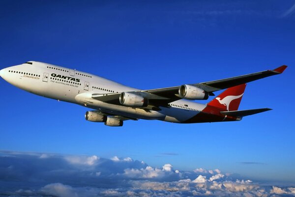 The plane is flying in the clouds at high speed