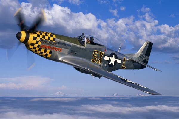 A North American fighter jet flies over a blue background