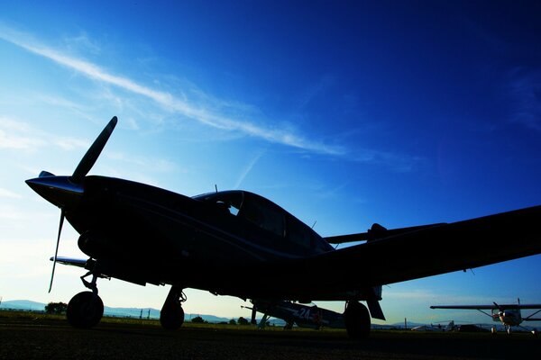 Photo of an aviation fighter against the background of the evening sky