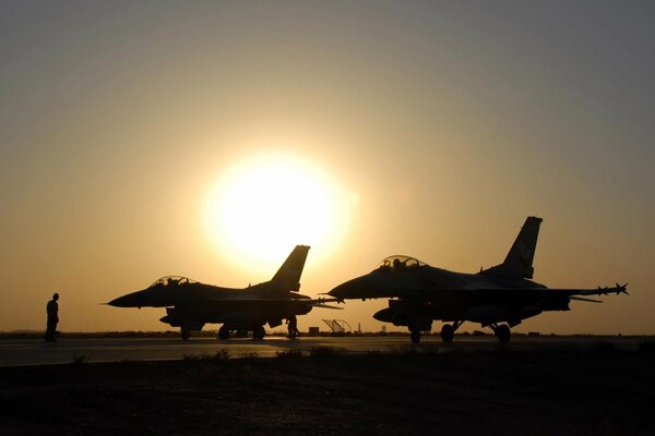 Fighter jets on the background of a beautiful sunset