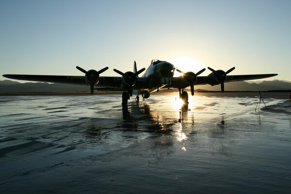 Airplane on the background of the illuminated sky