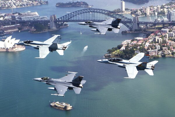 Four fighters pass over the city