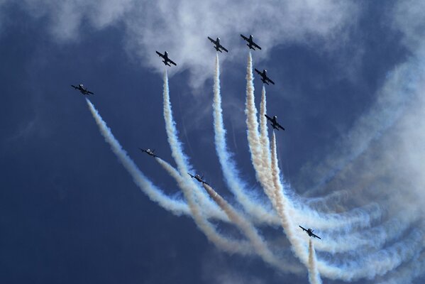 Parade of planes with a train in the sky