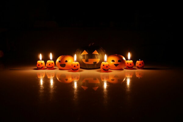 Orange pumpkins with lights on a black background