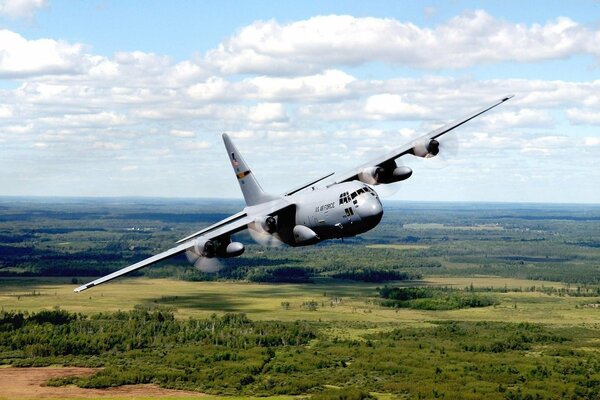 A big beautiful plane over the forest