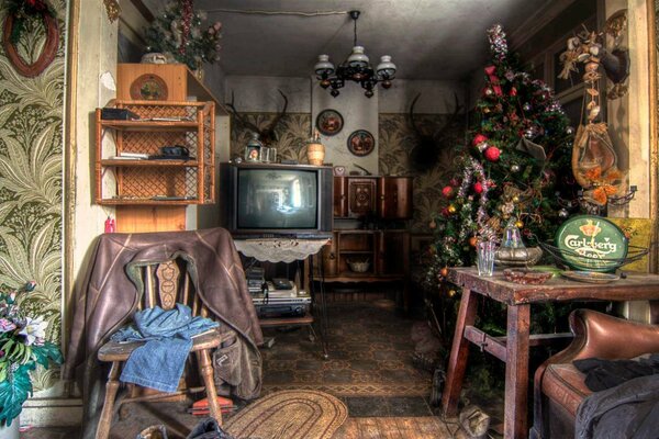 A room with a Christmas tree and toys