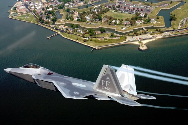 Raptor jet fighter flies over the city