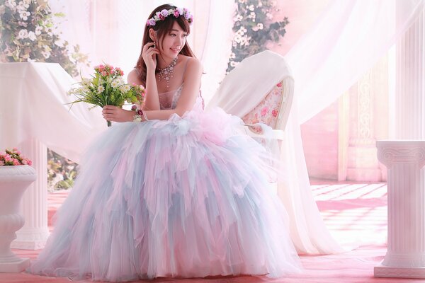 A joyful bride holds a bouquet of flowers