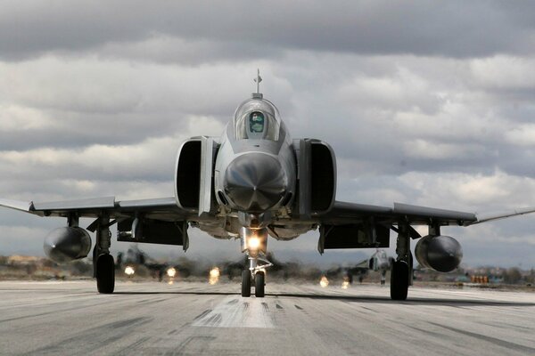 The plane leaving the base on the runway