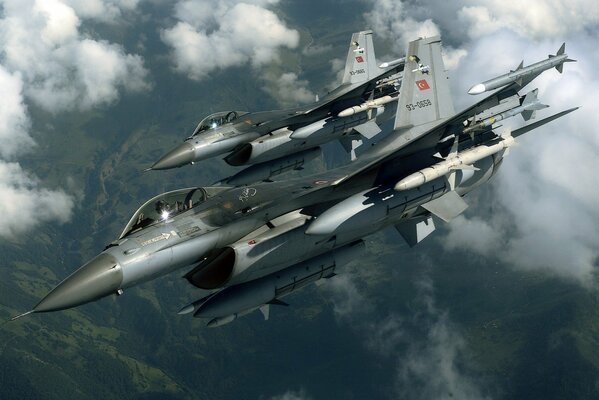 Two Turkish fighter jets flying in the sky