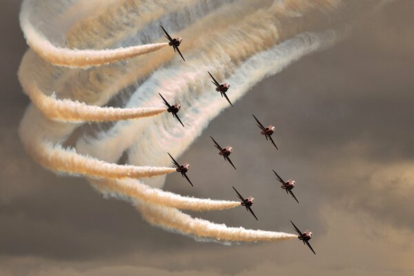 Planes perform beautiful stunts in the sky