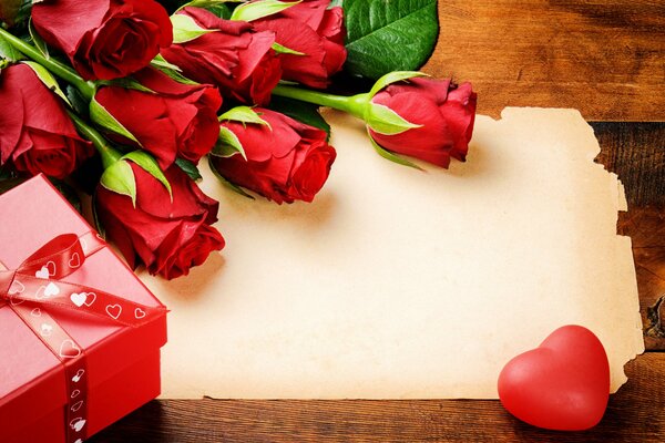 Gift in a box and red roses