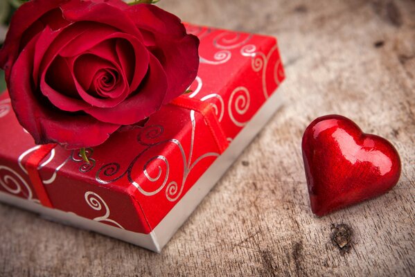 Gift box with a heart and a rose