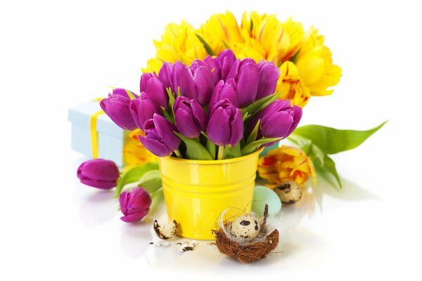 Tulips in a bucket with an Easter egg