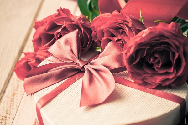 Roses on a box with a bow