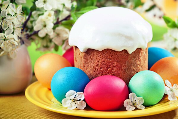 Easter cake in icing with colored eggs