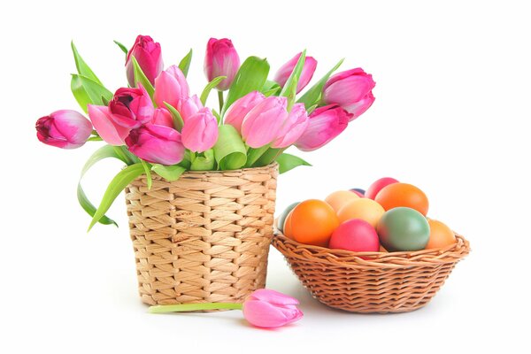 A basket of tulips and a basket of Easter eggs