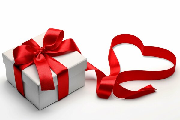 A gift with a red ribbon and a heart