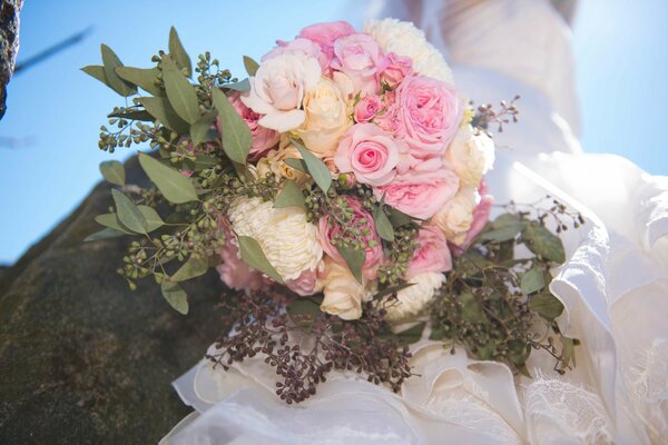 The bride s bouquet is the main thing in the image
